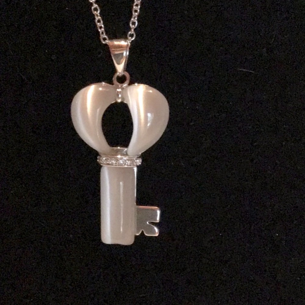 New Fashion Key, white cats eye stone clear accent stones.